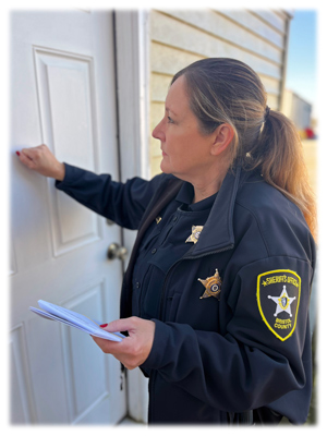 an image of a BCSO deputy serving papers
